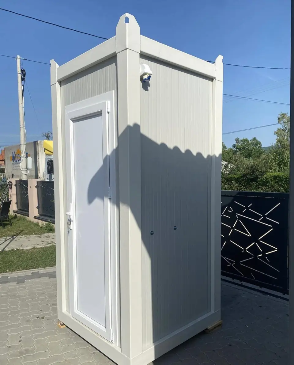 White deluxe portable restroom cabin with a full door