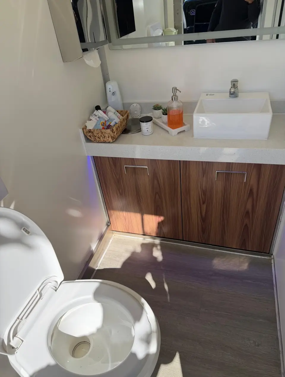 Vessel sink and soap on a restroom trailer vanity