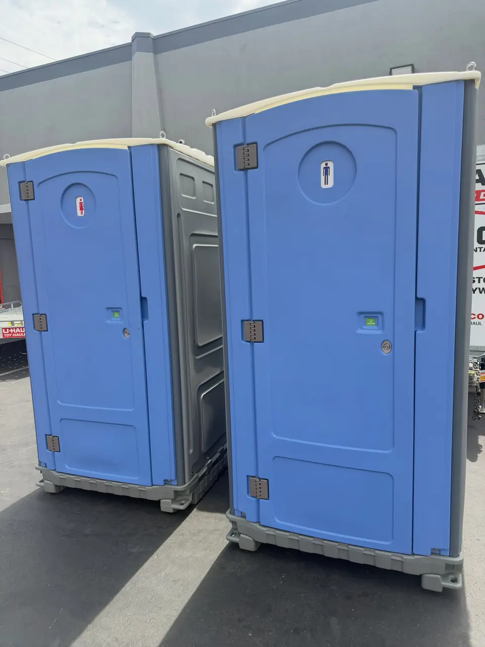 Pair of blue standard portable toilets
